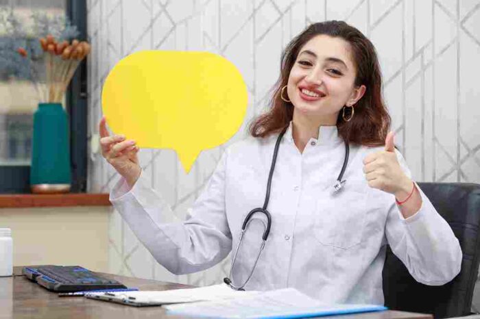 happy young health care worker holding idea bubble gesture thumb up high quality photo 11zon